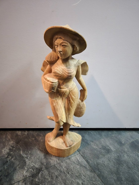 Image 1 of Balinese wooden female statue. Height 44 cm