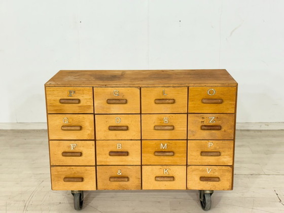 Image 1 of Beautiful vintage apothecary cabinet / compartment cabinet on casters – 16 compartments