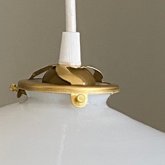 Image 1 of Antique pendant light with a white opaline glass shade and a transparent wavy edge
