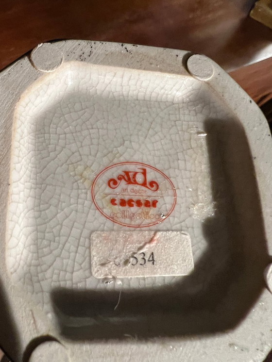 Image 1 of Rarität! Kerzenständer mit der Abbildung eines orientalischen Jünglings aus Messing auf schwarzem Porzellanfuß, 20. Jahrhundert 