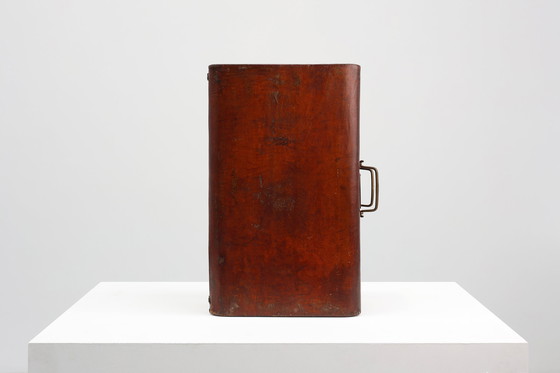 Image 1 of Vintage brown leather suitcase with copper details, China 1900s