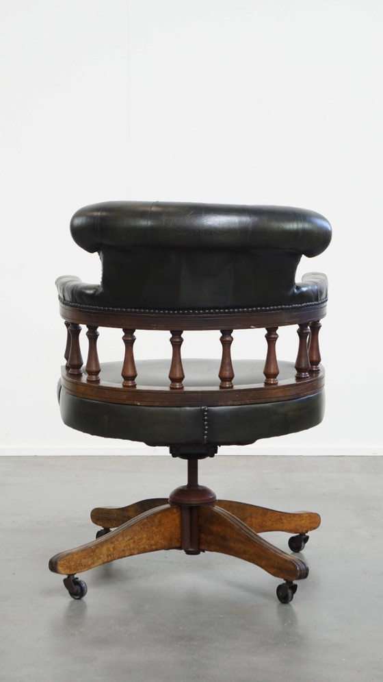 Image 1 of Dark green cowhide leather and wood swiffle and tilt chesterfield office chair