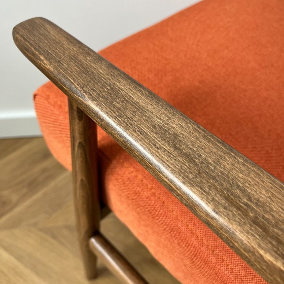 Image 1 of Vintage oranje Poolse fauteuil: loungestoel uit het midden van de 20e eeuw, gerestaureerd.