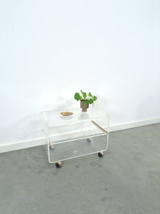 Image 1 of Space age plexiglas trolley met messing