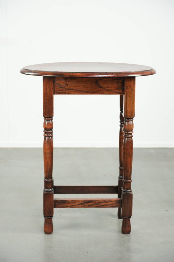 Image 1 of Antique oval English oak side table from the early 20th century with beautiful colors