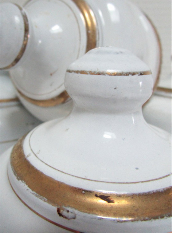 Image 1 of four enameled metal cheese bells, early 20th century