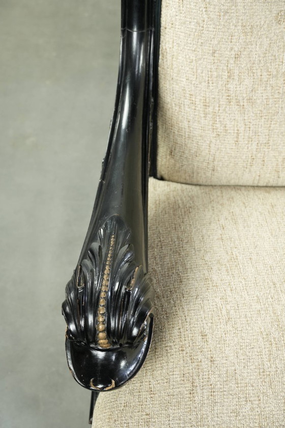 Luxurious 19th-century French sofa in Empire style with cream-colored fabric and uniquely detailed armrests. (photo 7 of 13)