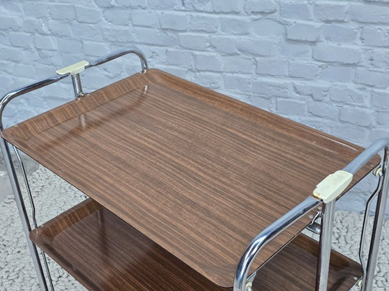 Image 1 of Vintage Foldable and Mobile Chrome Steel 3 Faux Wood Layers ‘Dinett’ Serving Trolley by Gerlinol, Germany, 1970s. 