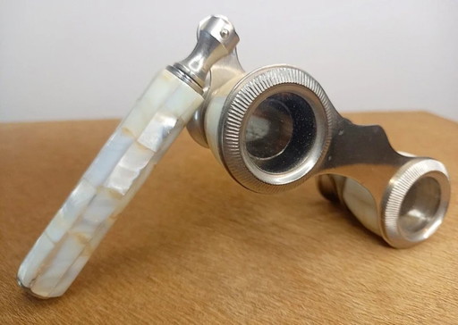 Vintage theatre glasses (opera glasses), made of metal and finished with mother-of-pearl (nacre) shell inlay.