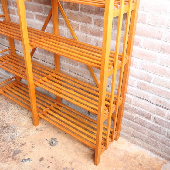 Image 1 of Libreria vintage con ante a doghe aperte, giocattoli e libri