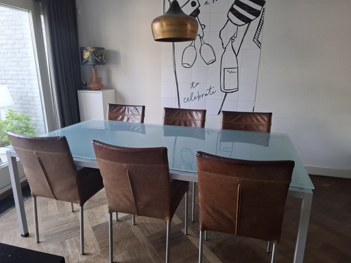Sturdy dining table with glass top