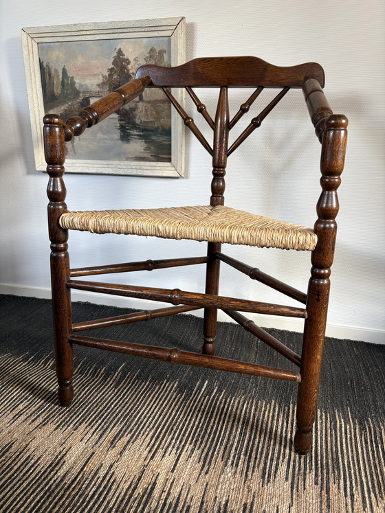 Image 1 of  Vintage Antiek 20ste eeuw eiken hoekstoel met biezen zitting h85cm