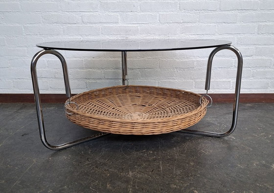 Image 1 of vintage round coffee table with glass top and wicker magazine basket