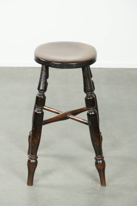 Image 1 of Antique English Windsor stool from the early 19th century with a unique oval shape