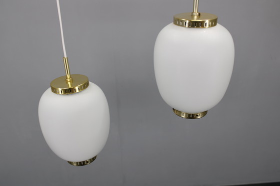 Image 1 of 1970 Karlby Paire de pendentifs en verre opalin et laiton par Lyfa, Danemark