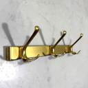 Gold-colored aluminum wall coat racks 1960s