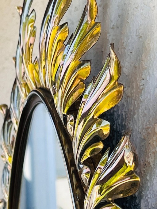 Miroir ovale décor feuilles en métal