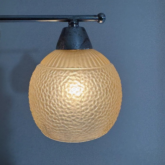 Image 1 of PAAR VINTAGE AMBERKLEURIGE WANDLAMPEN