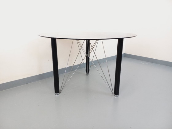 Image 1 of Vintage round dining table in smoked glass, black metal and chrome metal from the 80s
