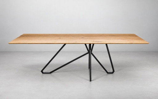 Dining table with wooden top and black metal base