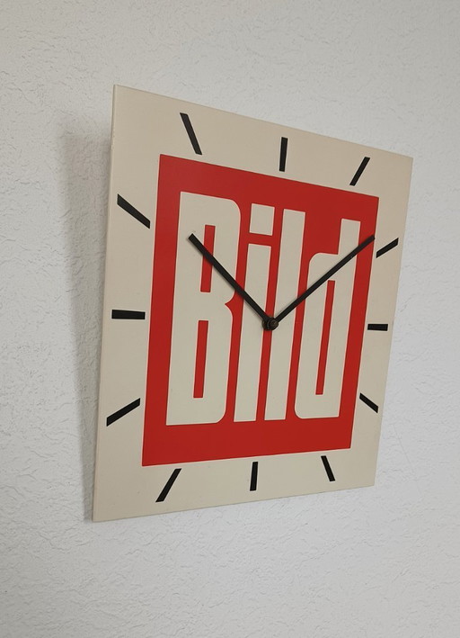 1970s wall clock with advertising