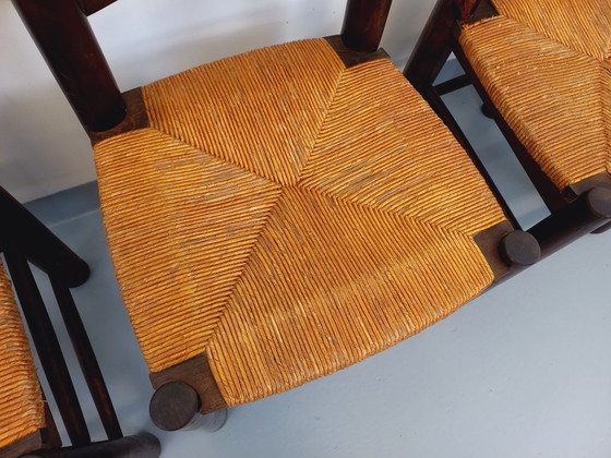 Image 1 of Set van 4 vintage brutalistische stoelen van Georges Robert, gemaakt van hout en stro, uit de jaren 50 en 60.