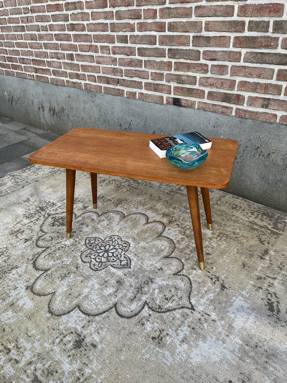 Image 1 of Vintage mid-century Danish coffee table on beautiful tapered legs with brass caps