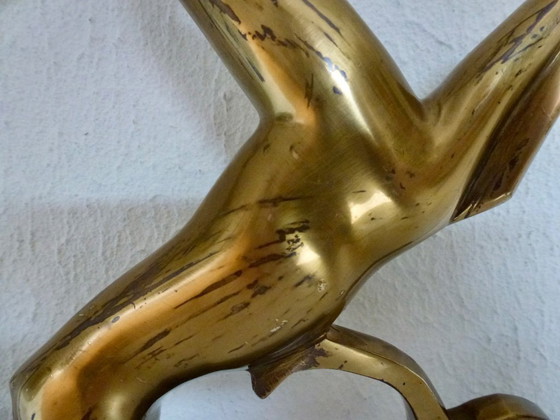 Image 1 of Beautiful brass gazelle on a lacquered wooden base.