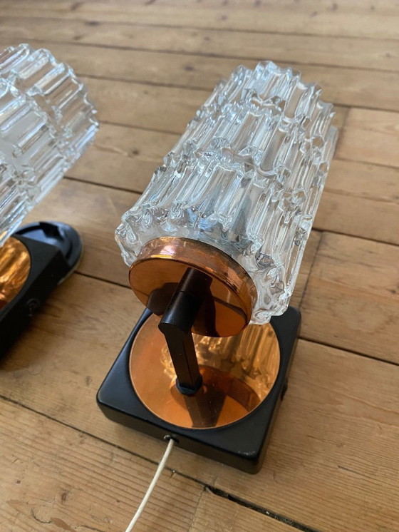 Image 1 of Een paar vintage koperen wandlampen van Phillips uit de jaren 70.