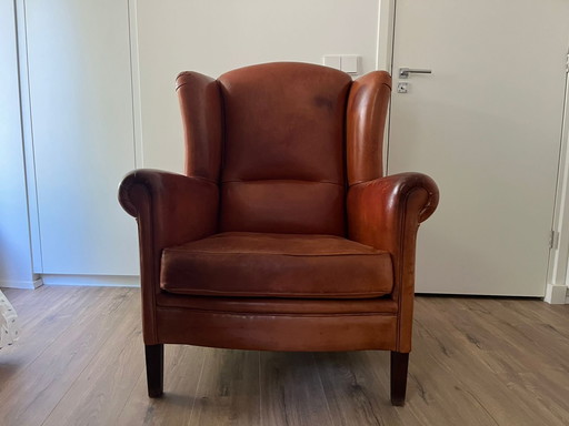 Fauteuil à oreilles en cuir