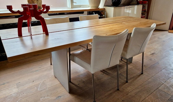 Image 1 of 4 dining room chairs upholstered in white leather