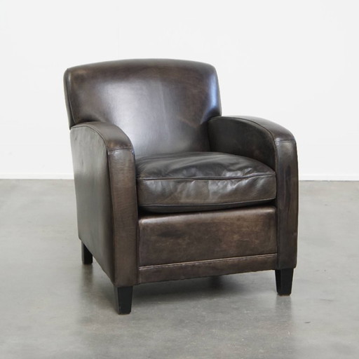 Zwart/ grijze design fauteuil/ armchair gemaakt van schapenleer