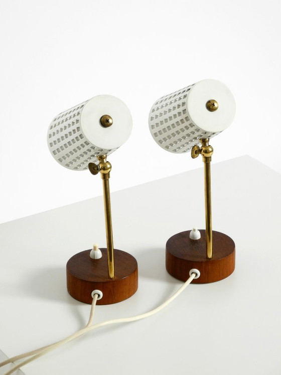 Image 1 of A pair of beautiful mid-century modern bedside lamps with perforated metal shades and teak wood bases