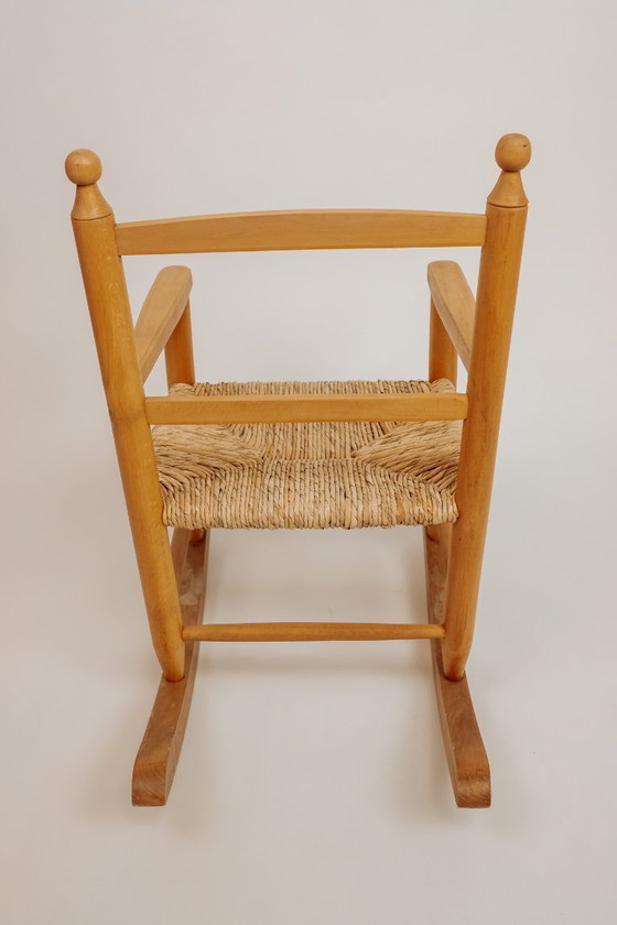 Image 1 of Vintage wooden children's rocking chair with rush seat