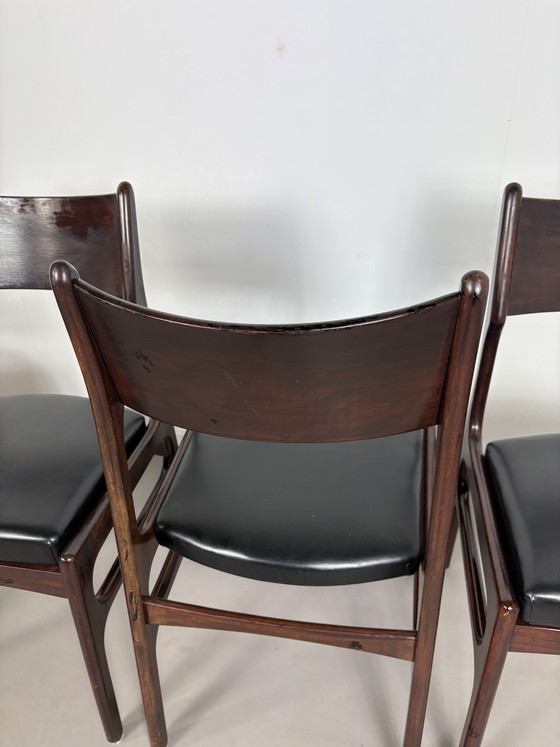 Image 1 of Set off 4 Vintage Palissander Wood With Black skai Leather dining chairs