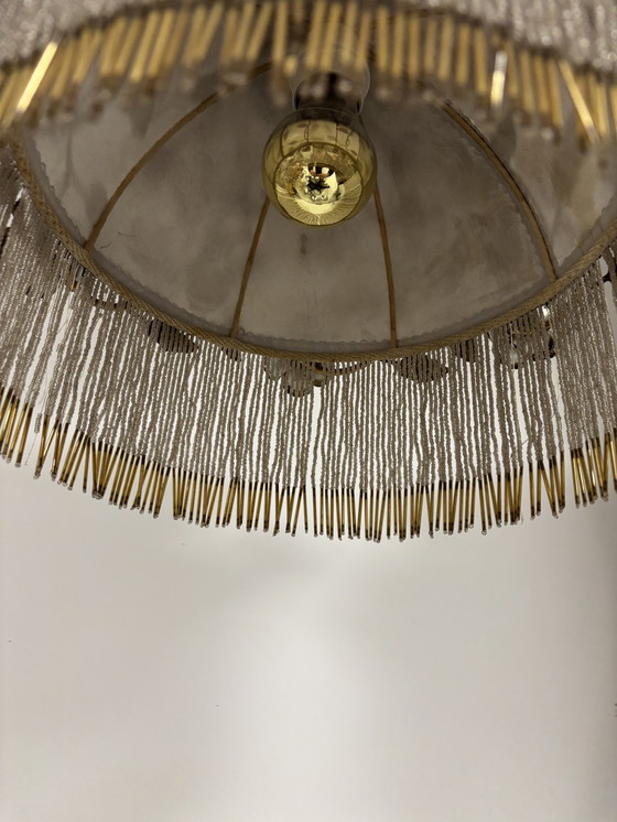 Image 1 of Exclusive chandelier with brass leaves and silver-colored roses