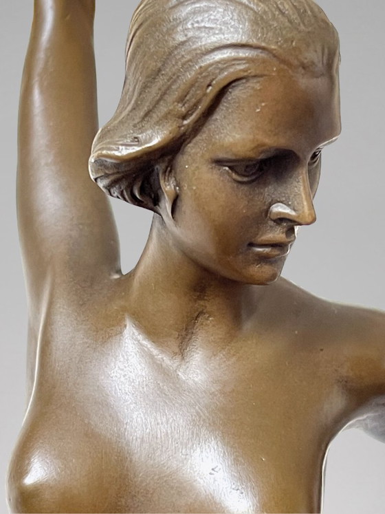 Image 1 of Art Deco sculpture of a dancer with rings in patinated bronze on a black marble-effect base – signed Duvernet – 58 cm