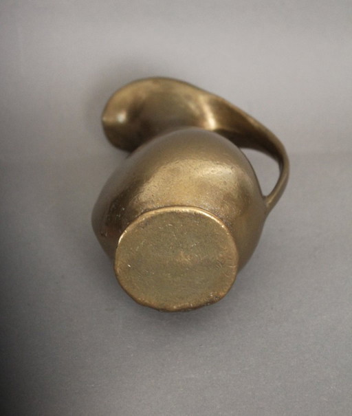 Massive, heavy brass vase in the shape of a jug