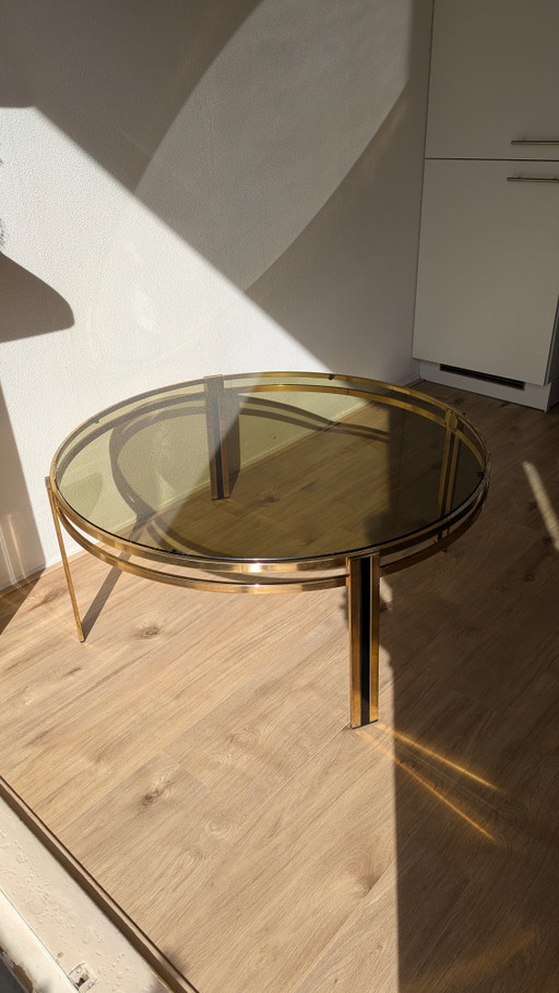 Hollywood Regency salontafel van zwart messing en gerookt glas