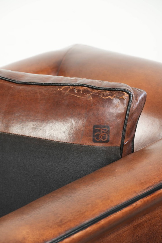 Image 1 of Sheepskin Art Deco design armchair with black piping