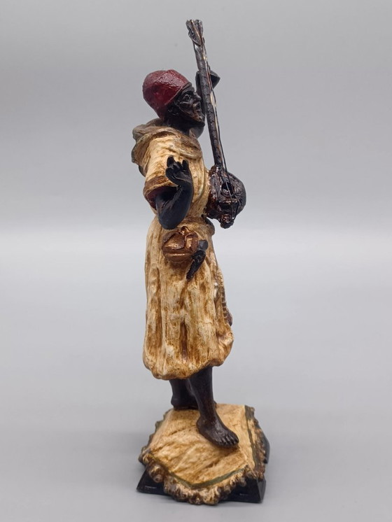 Image 1 of Ecole Orientaliste du XXème siècle, Musicien de rue en métal belle patine