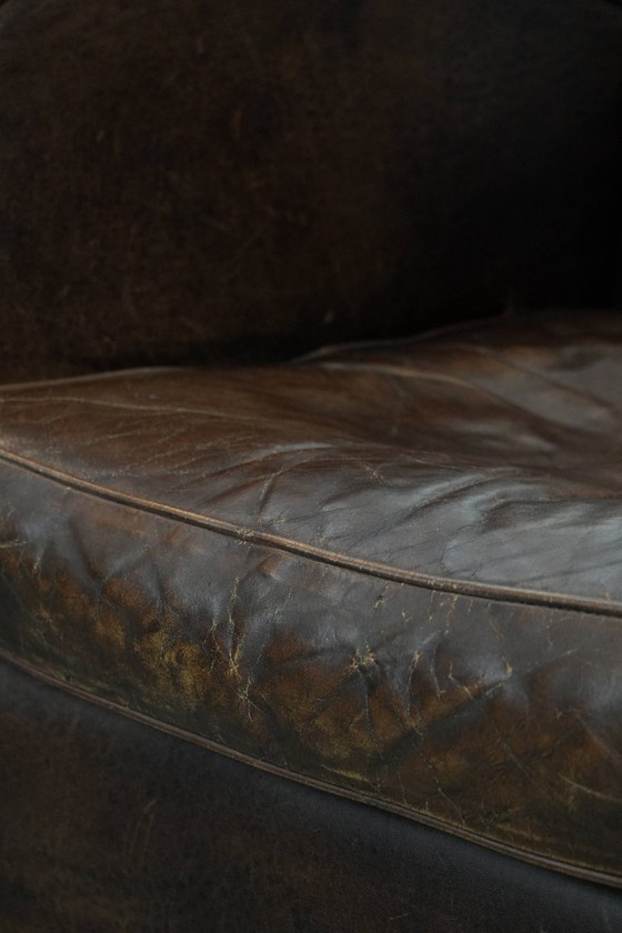 Image 1 of 2 x Vintage schapenleren design fauteuil in een donkere cognac kleur