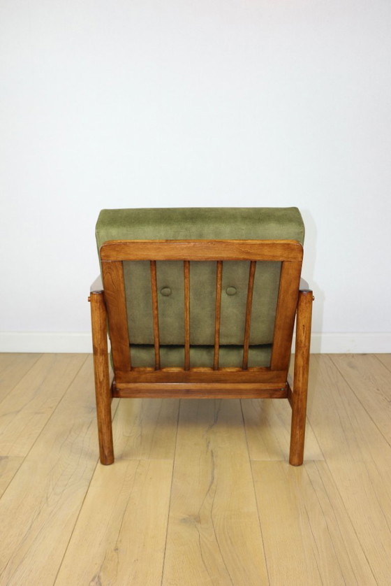 Image 1 of Wooden armchair designed by Z. Baczyk in a vintage style, upholstered in olive green velvet.