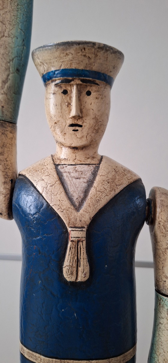 Image 1 of Antieke matroos met roeispanen als armen