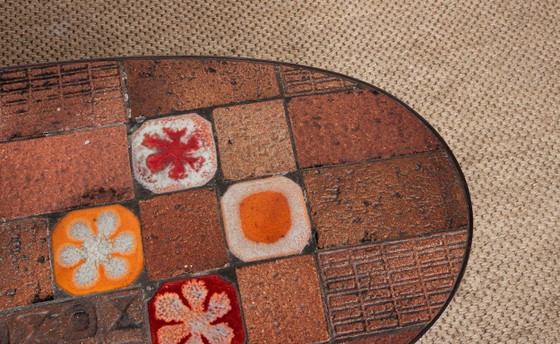 Image 1 of Tavolino da caffè in pietra lavica, ceramica e acciaio, disegnato da Jean Jaffeux nel 1960.