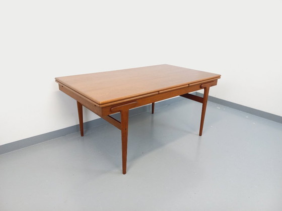Image 1 of Vintage Scandinavian rectangular dining table by Ejvind A. Johansson from the 50s and 60s in teak with integrated extensions