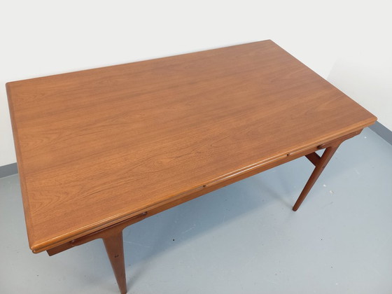 Image 1 of Vintage Scandinavian rectangular dining table by Ejvind A. Johansson from the 50s and 60s in teak with integrated extensions