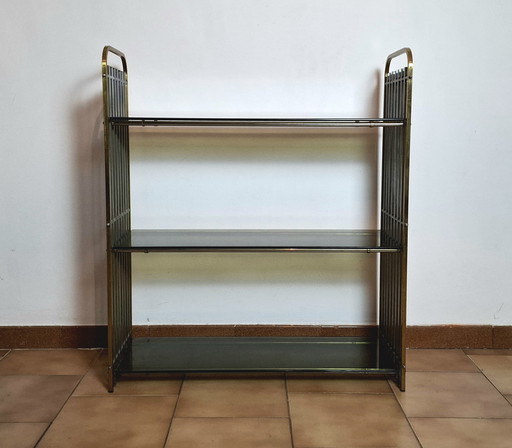 Italian shelf in chromed metal, brass and glass. 1970s.