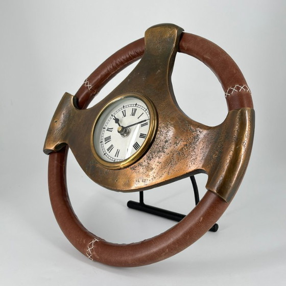 Image 1 of Sculptural steering wheel table clock made of patinated metal – Vintage Automobilia
