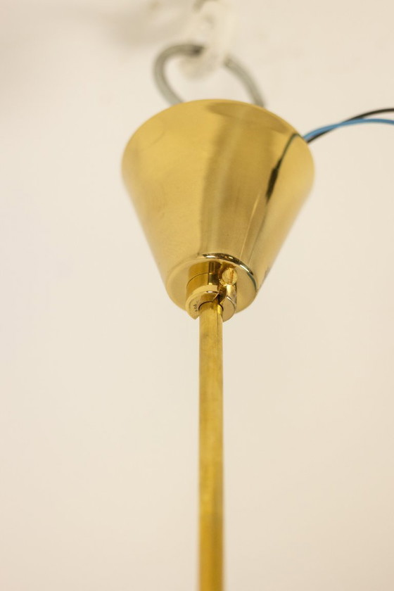 Image 1 of Kamenicky Senov, editor. Pair of brass and glass chandeliers. Circa 1970